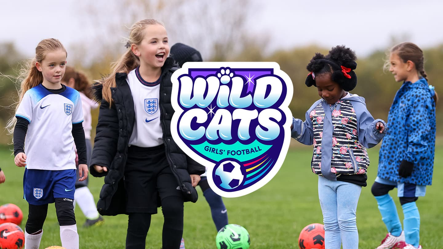 Young girls enjoying football at Wild Cats session